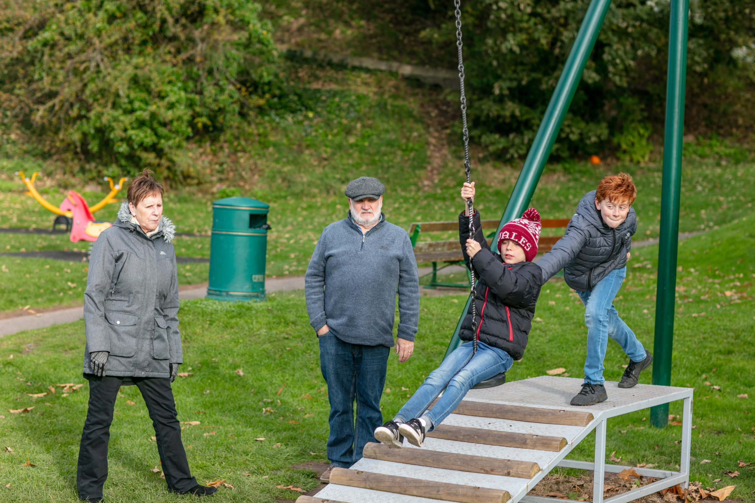 family playing at the park